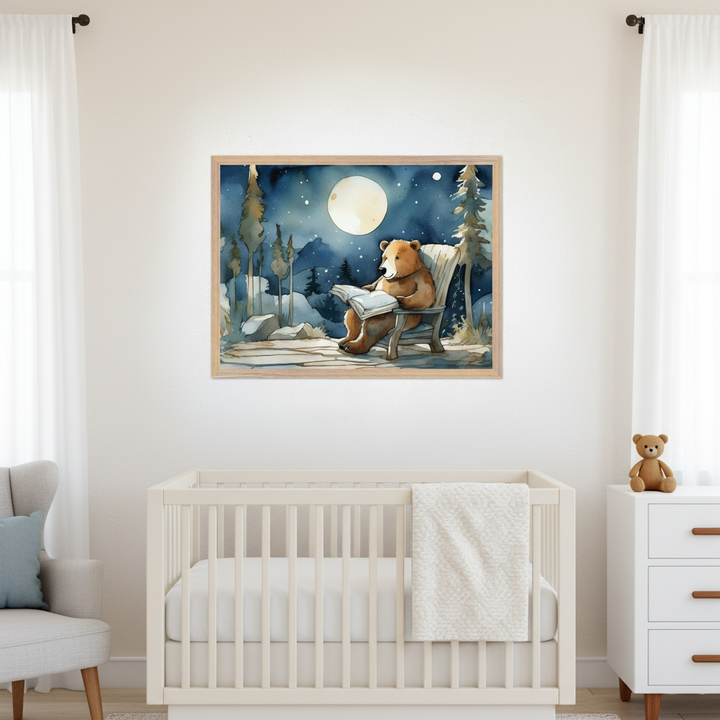 Modern nursery with a white crib, light gray armchair, and white dresser. A framed watercolor painting of a bear reading under a full moon in a starry winter forest hangs centered above the crib.