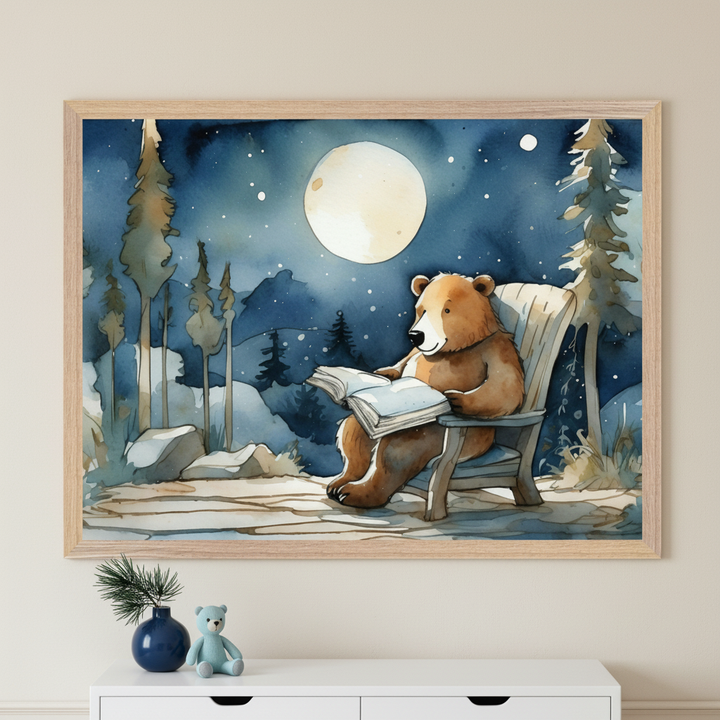 Neutral room with a white dresser. Above it hangs a framed watercolor painting of a brown bear reading a book in an Adirondack chair under a full moon and stars in a forest. A blue teddy bear and plant adorn the dresser.