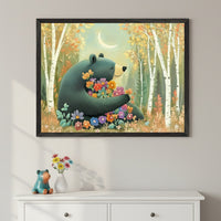 Modern room with a white dresser. A large framed painting of a teal bear holding colorful flowers in an autumn birch forest under a crescent moon hangs centered above the dresser. A small teal bear figurine and a vase of flowers are on the dresser.