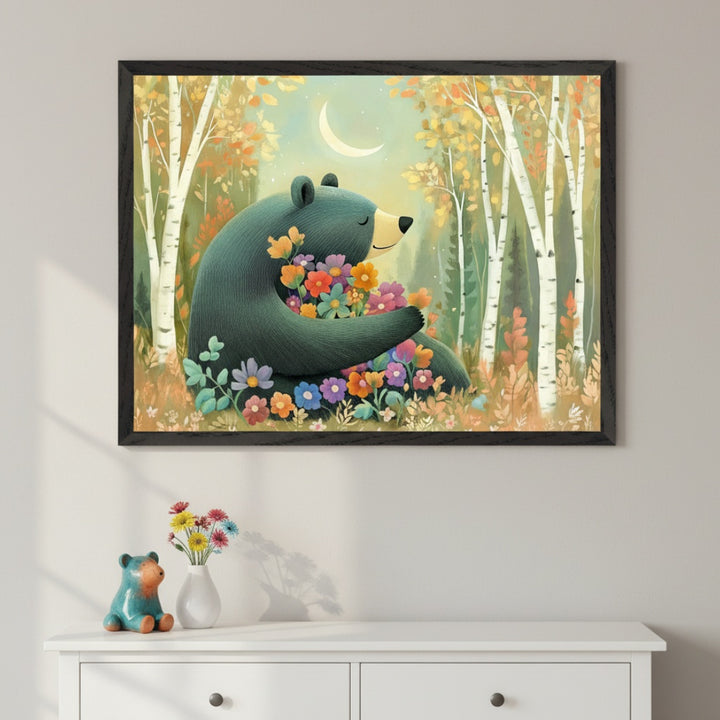 Modern room with a white dresser. A large framed painting of a teal bear holding colorful flowers in an autumn birch forest under a crescent moon hangs centered above the dresser. A small teal bear figurine and a vase of flowers are on the dresser.