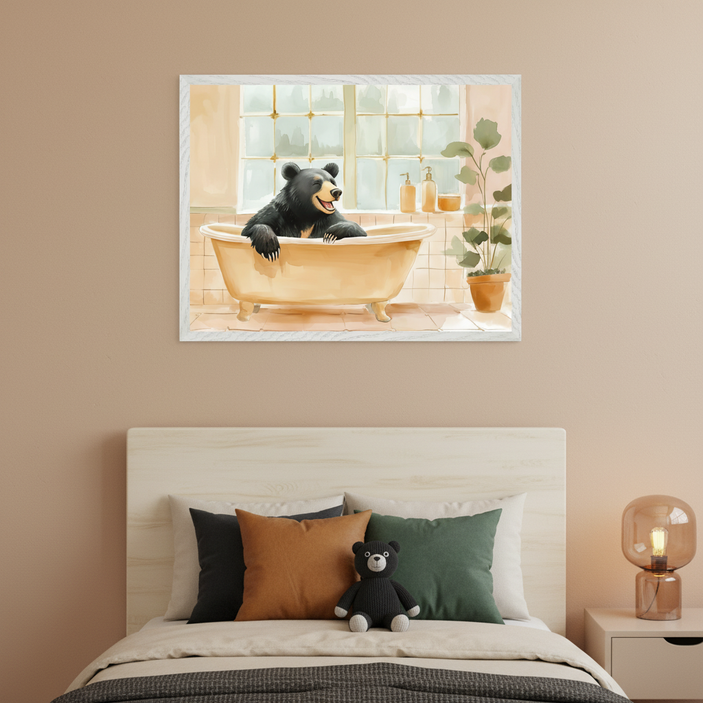 Child's bedroom with a light wood bed. A framed watercolor painting of a black bear in a yellow clawfoot bathtub hangs centered above the bed. The bed has pillows and a black teddy bear.