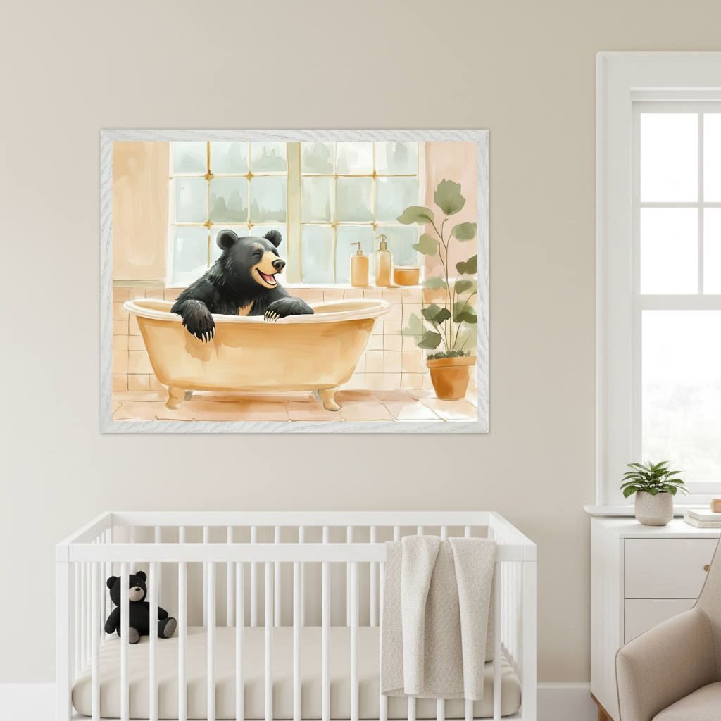 Modern nursery with a white framed watercolor painting of a smiling black bear in a yellow bathtub, centered above a white crib. The art depicts a bear in a bathroom with tiles, bath products, and a potted plant. A white dresser and a light armchair are visible to the right.