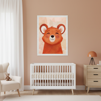 Modern nursery with a white crib, beige armchair, and wood dresser. A framed cartoon print of a happy brown bear hangs above the crib on a light brown wall.