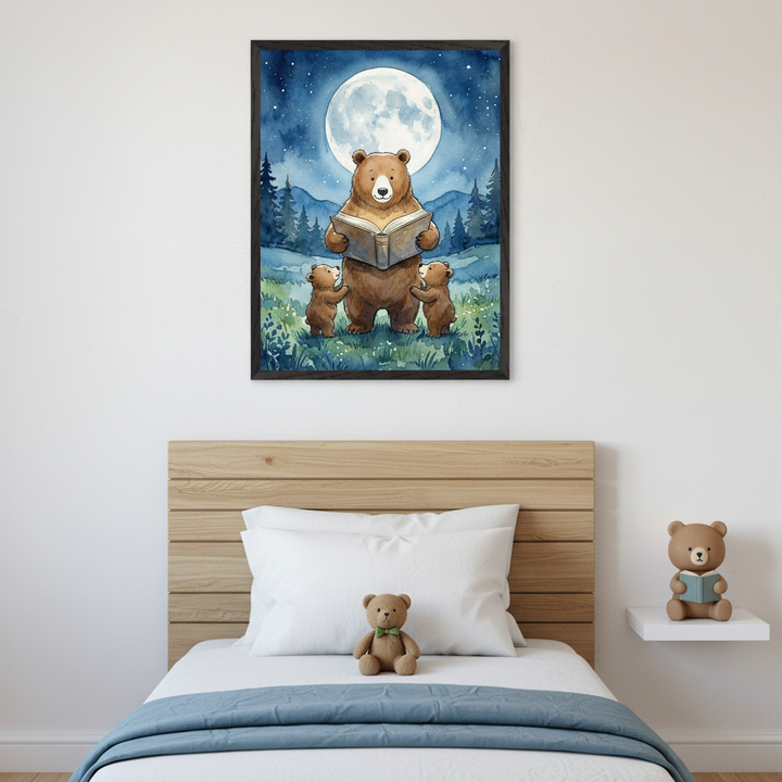 Kid's bedroom with a wooden bed frame, white bedding, and blue blanket. A framed watercolor illustration of a brown bear reading a book to two cubs under a full moon in a forest hangs above the bed. A teddy bear with a green bow tie is on the bed, and a bear figurine reading a book sits on a white floating shelf.