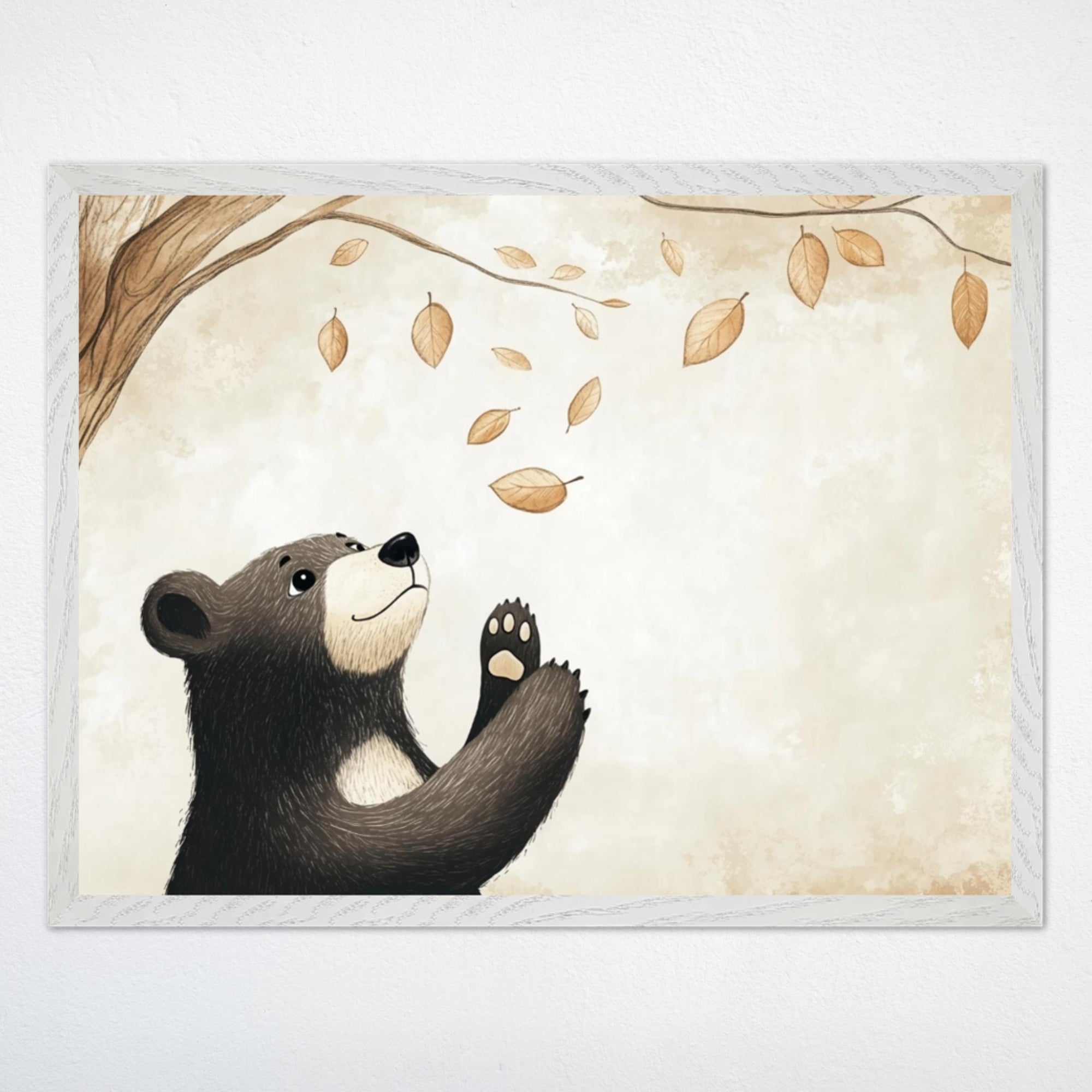 Framed illustration of a cute black bear cub with a cream-colored snout and chest reaching up toward falling autumn leaves. The background features soft beige tones and a tree branch stretching from the top left corner.