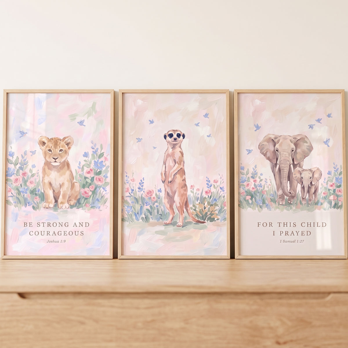Bible verse safari animals wall art set of 3 with a lion cub, meerkat, and elephants in soft pastel floral settings.