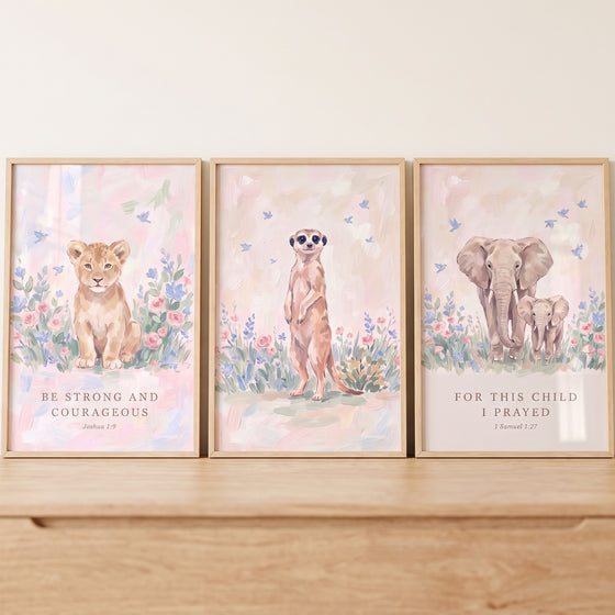 Bible verse safari animals wall art set of 3 with a lion cub, meerkat, and elephants in soft pastel floral settings.