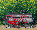 A vibrant red bicycle is parked against a wooden bench surrounded by lush green foliage with bright yellow flowers, creating a picturesque and serene outdoor scene.