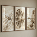 A triptych of three vertical illustrations, framed in thin brown wood, hangs on a neutral beige wall. The artwork features a vintage, sepia-toned aesthetic with detailed ink and wash techniques. The left piece depicts a biplane flying over a range of jagged, snow-dusted mountains. The center illustration is a detailed, technical close-up of a radial aircraft engine and its propeller hub. The right piece shows a twin-engine aircraft flying alongside a towering, rocky cliff face that drops into the sea.