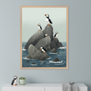 Modern room with a white dresser. A large framed print of cartoonish puffins on dark rocks in a blue ocean hangs above the dresser. A puffin figurine, a succulent, and a folded blanket are on the dresser.
