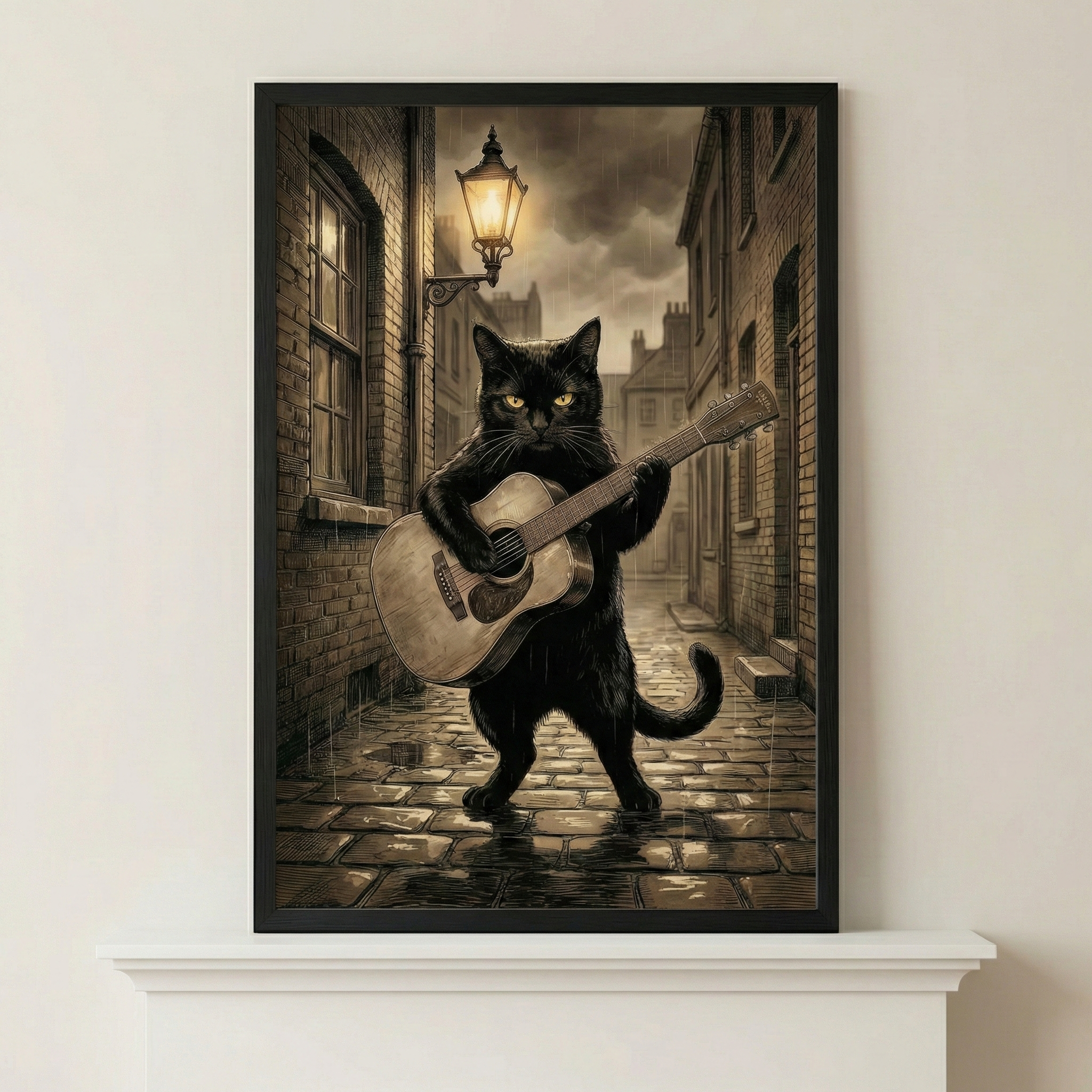 A vertical framed piece of art displays a black cat standing upright on its hind legs in the middle of a narrow, wet cobblestone street. The cat is shown playing an acoustic guitar with a serious expression and glowing yellow eyes. Rain falls through the scene, lit by the warm, golden glow of an old-fashioned street lamp mounted on a brick wall to the left. The light creates shimmering reflections on the damp ground and highlights the cat's fur. 