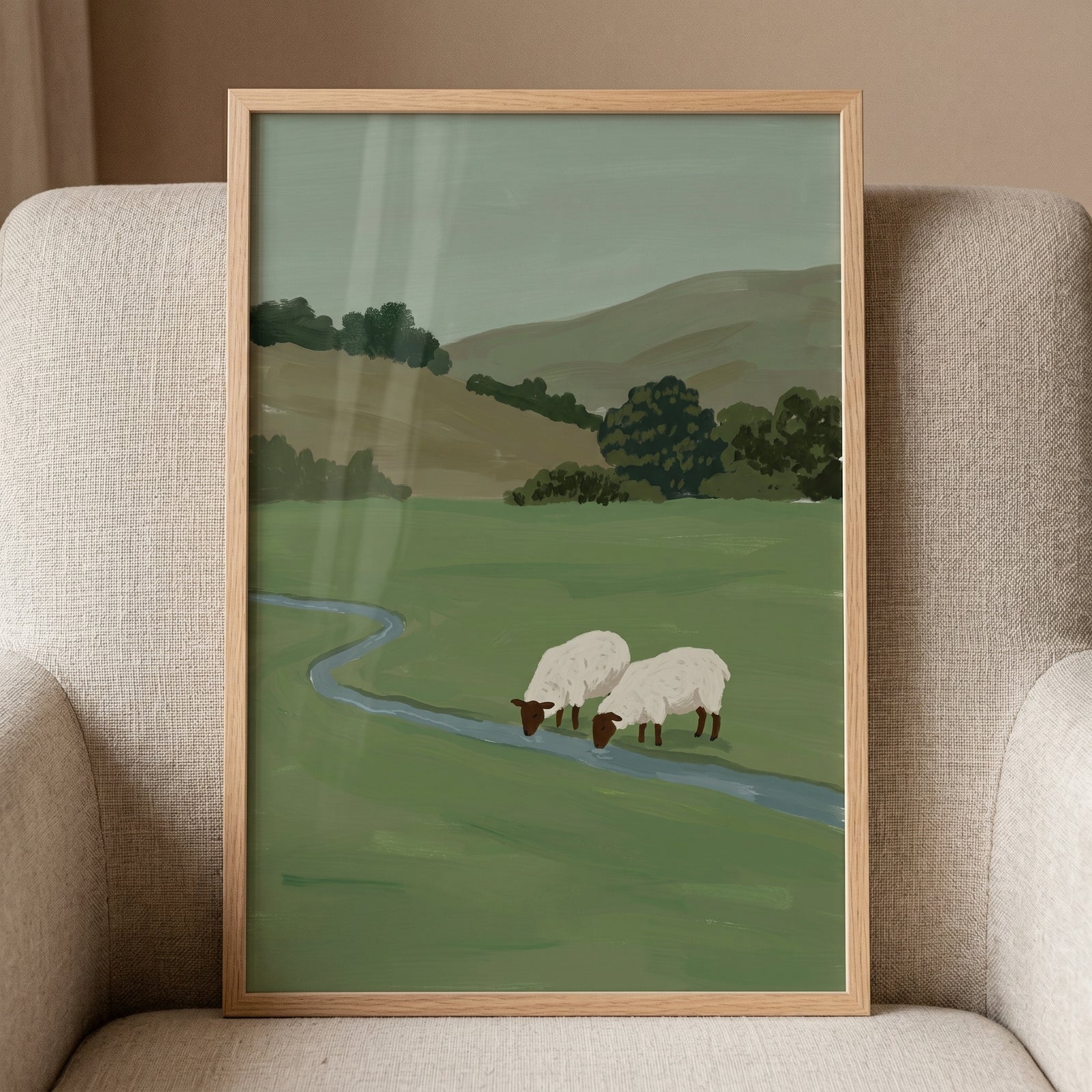 Black face woolly sheep wall art of two sheep grazing by a winding stream in a green field with rolling hills.
