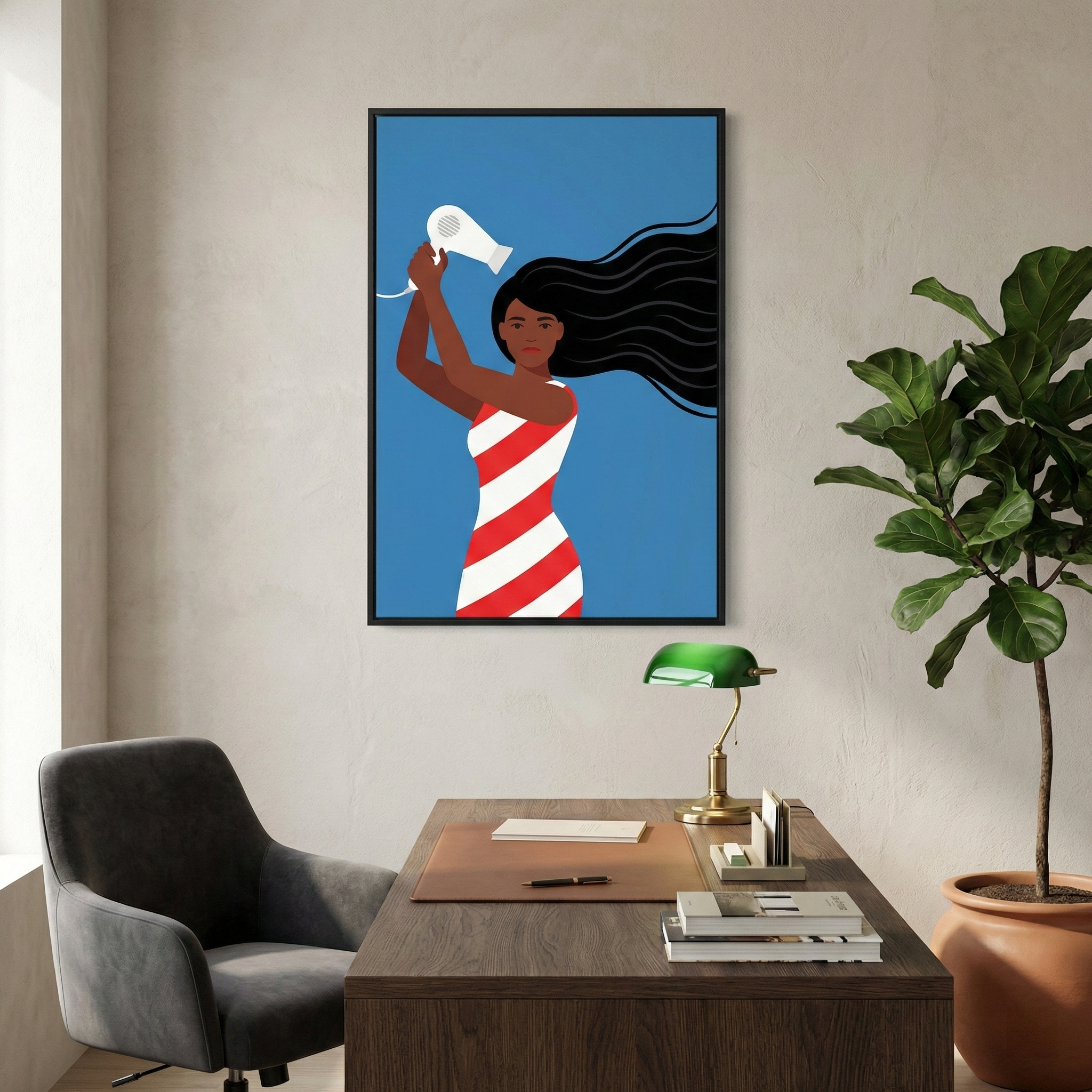 A minimalist interior features a framed graphic illustration hanging on a light-colored wall. The art depicts a woman with dark skin and long, flowing black hair wearing a red and white striped dress. She holds a white hair dryer as if to blow her hair. The background of the print is a solid, vibrant blue.
