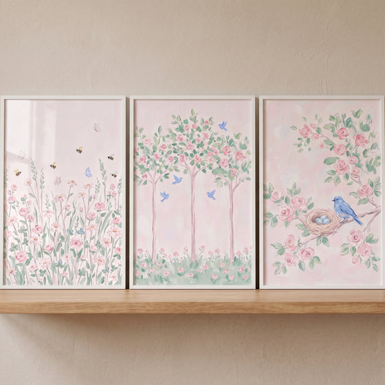 Blossoming pink rose garden wall art set of 3 on a wooden shelf featuring flowers, trees, and a blue bird on a nest.