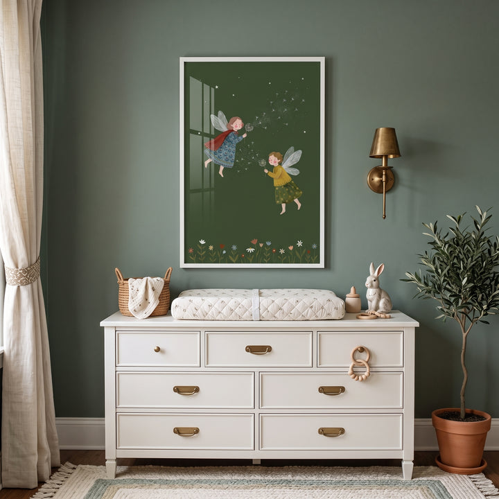 Blowing dandelion seed fairies wall art above a white dresser in a green nursery featuring a plant and rabbit figurine.