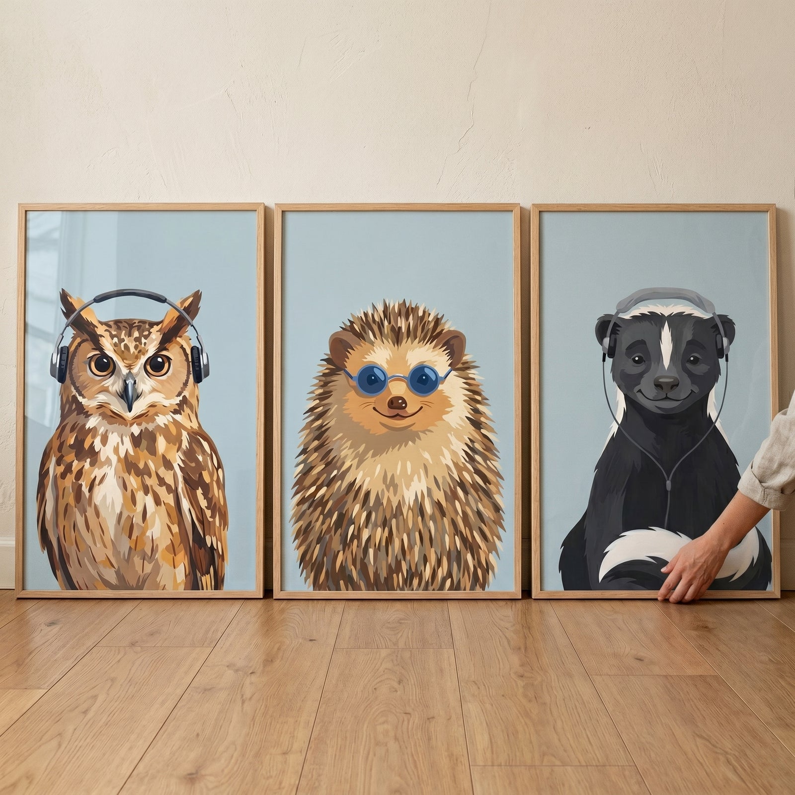 Blue accessory forest animal wall art set of 3 featuring an owl, hedgehog, and skunk wearing glasses and headphones.