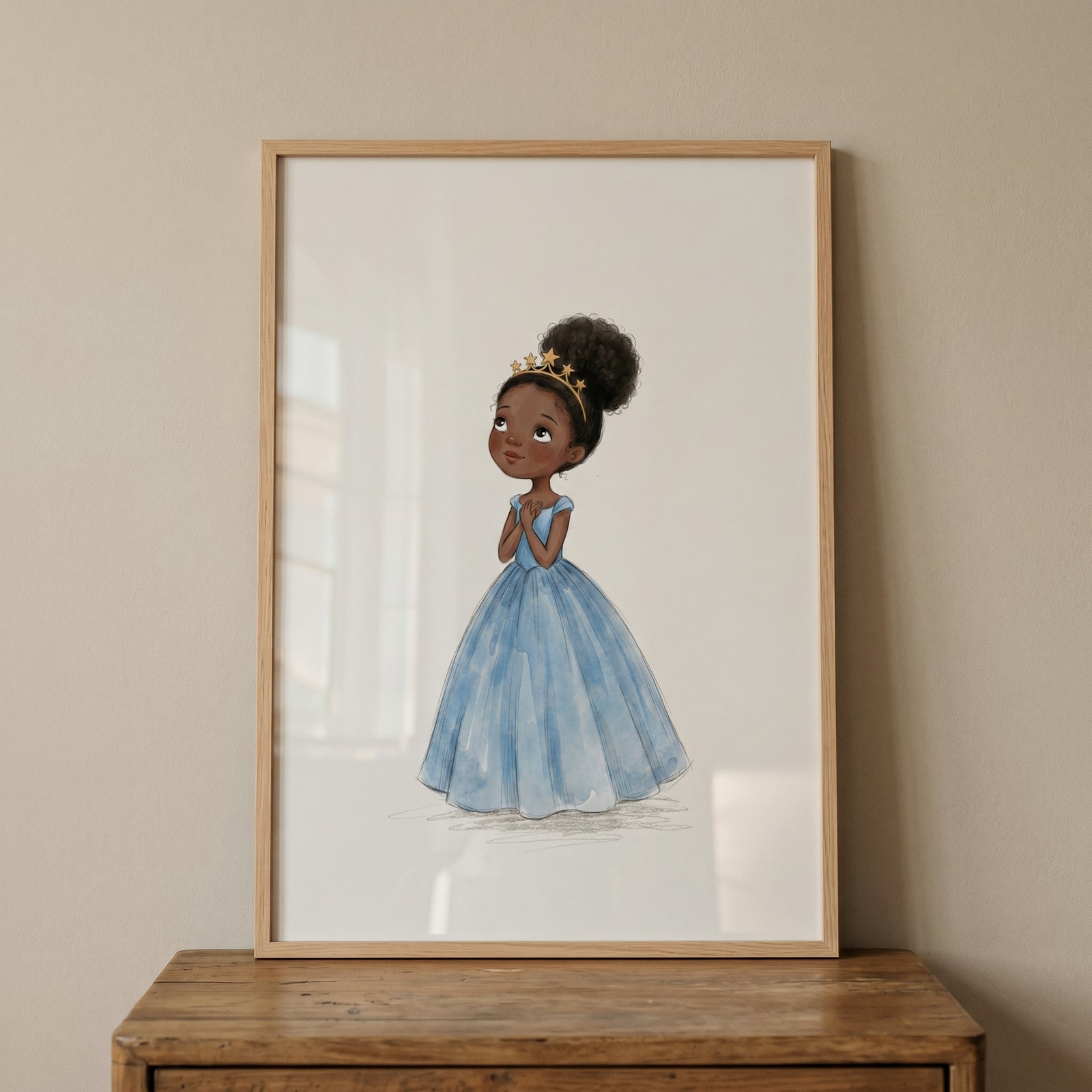 Framed blue ball gown girl wall art of a young Black princess wearing a star crown and natural hair puff.