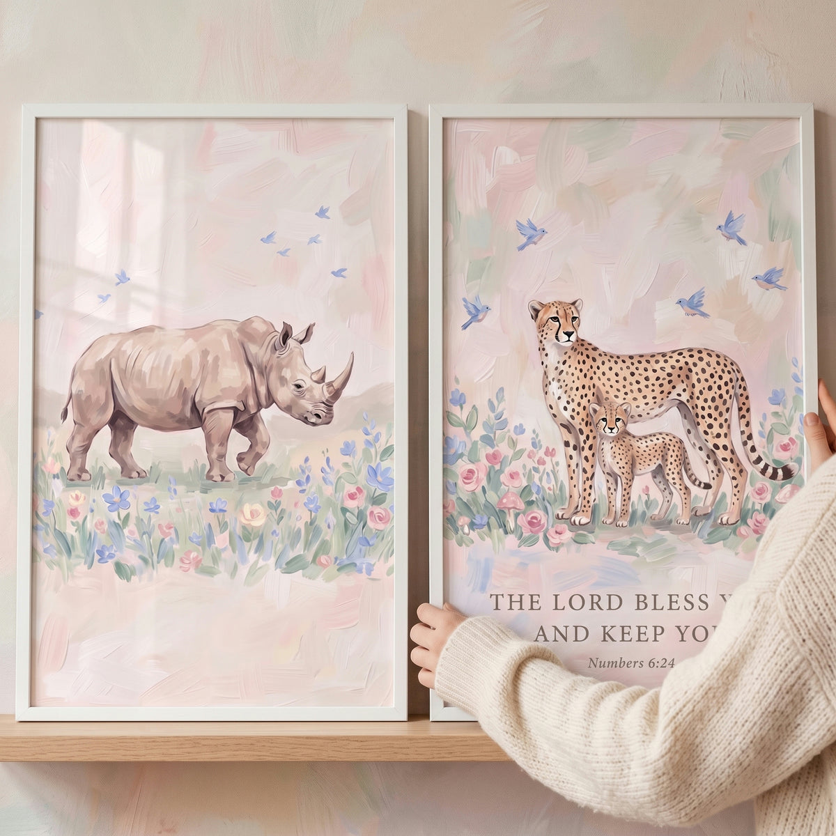Blue bird safari animals wall art set of 2 with a rhinoceros and cheetah family in soft floral pastel landscapes.