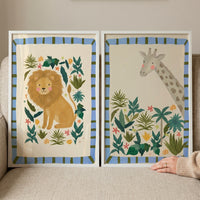 A blue border safari animal wall art set of 2 featuring a friendly lion and a giraffe surrounded by jungle foliage.