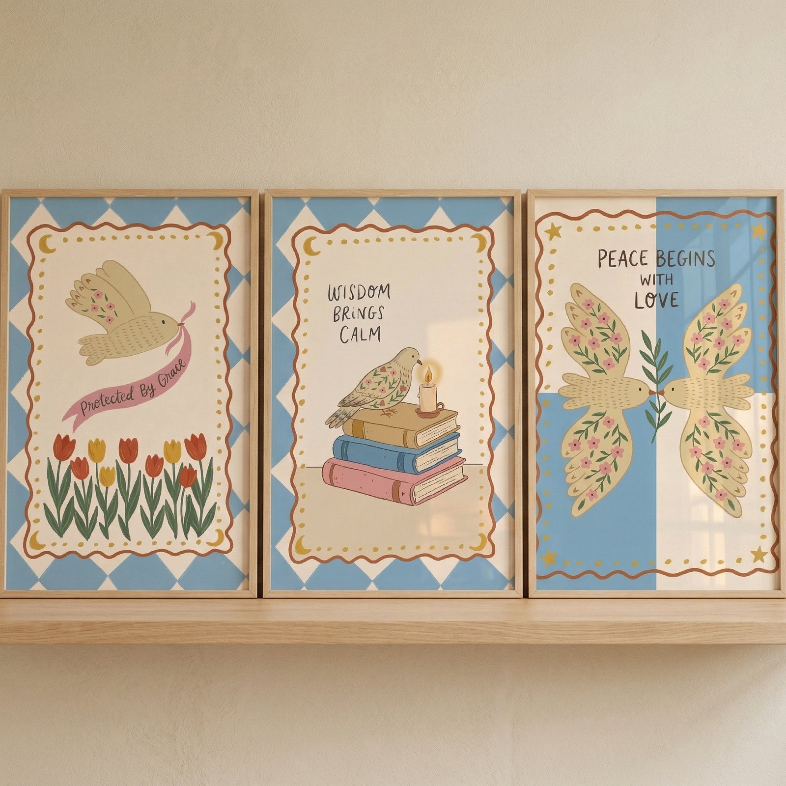 Blue diamond floral bird wall art set of 3 featuring birds and flowers displayed on a wooden shelf.