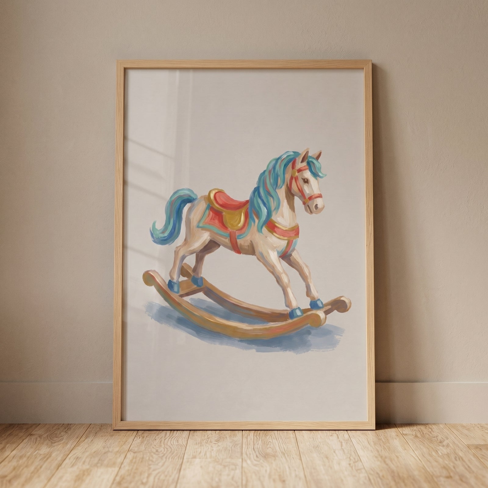 Framed blue mane rocking horse wall art with a red saddle leaning against a neutral wall on a light wood floor.