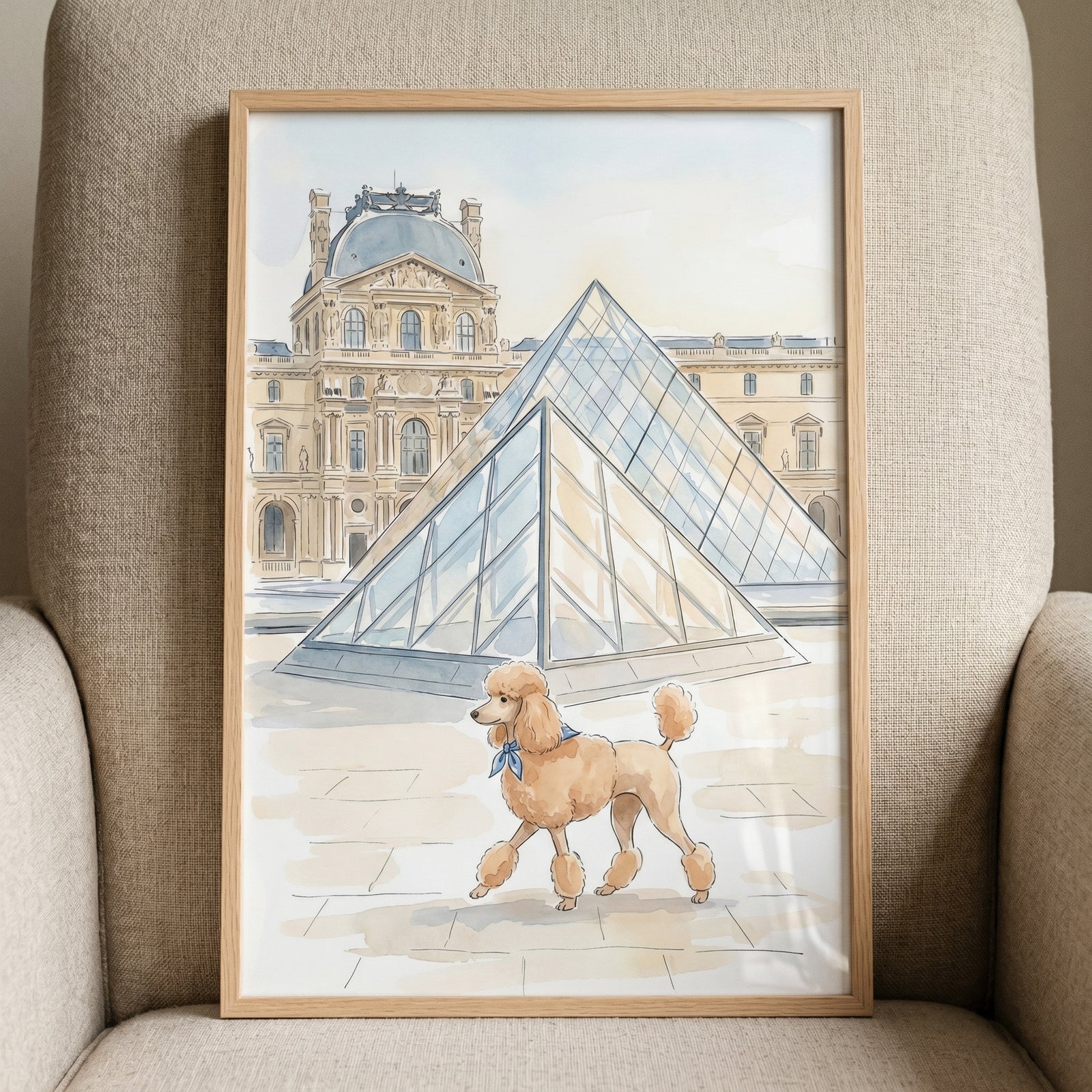 Blue scarf apricot poodle wall art shows a dog walking past a glass pyramid and historic palace in a light wood frame.