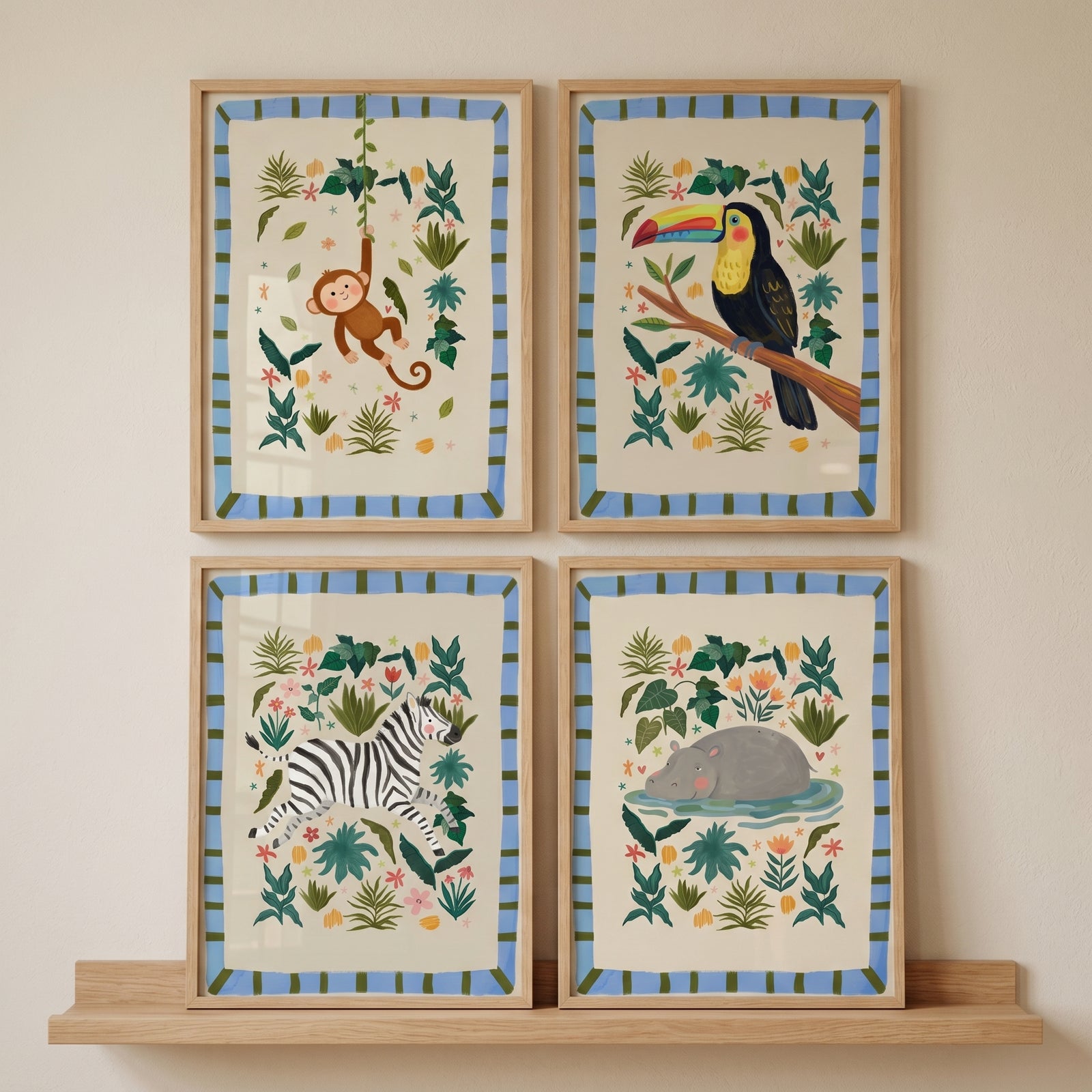 Framed blue stripe jungle animal wall art set of 4 showcasing a monkey, toucan, zebra, and hippo above a wooden shelf.