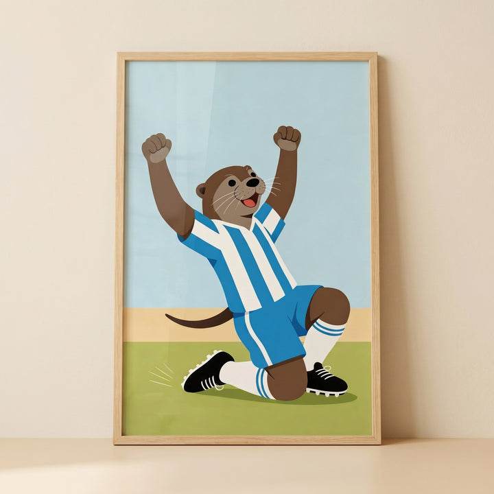 Blue striped jersey otter wall art depicts a cartoon otter celebrating on a green soccer field in a light wooden frame.
