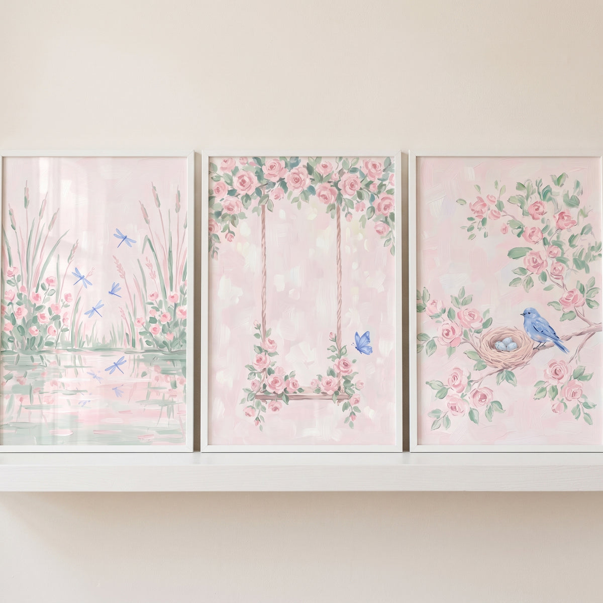 Blue touch pink garden wall art set of 3 with dragonflies by a pond, a floral swing, and a blue bird near its nest.