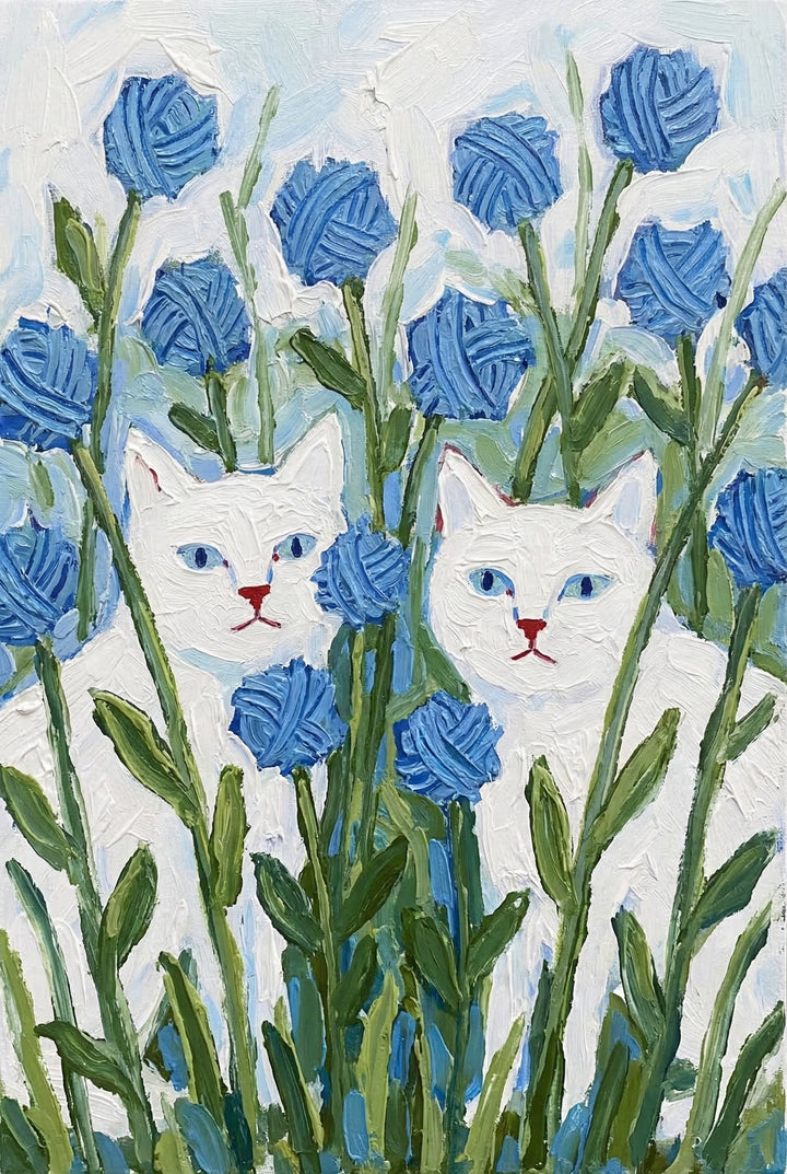A vertical textured artwork created with thick impasto strokes. Two white cats with bright blue eyes and small red noses are depicted peering out from a garden of unusual plants. The plants consist of long green stalks with narrow leaves, topped with round blue spheres that are textured to resemble balls of yarn. The background is a light, airy mix of pale blue and white. The entire image has a heavy, tactile surface with visible, raised marks of material.