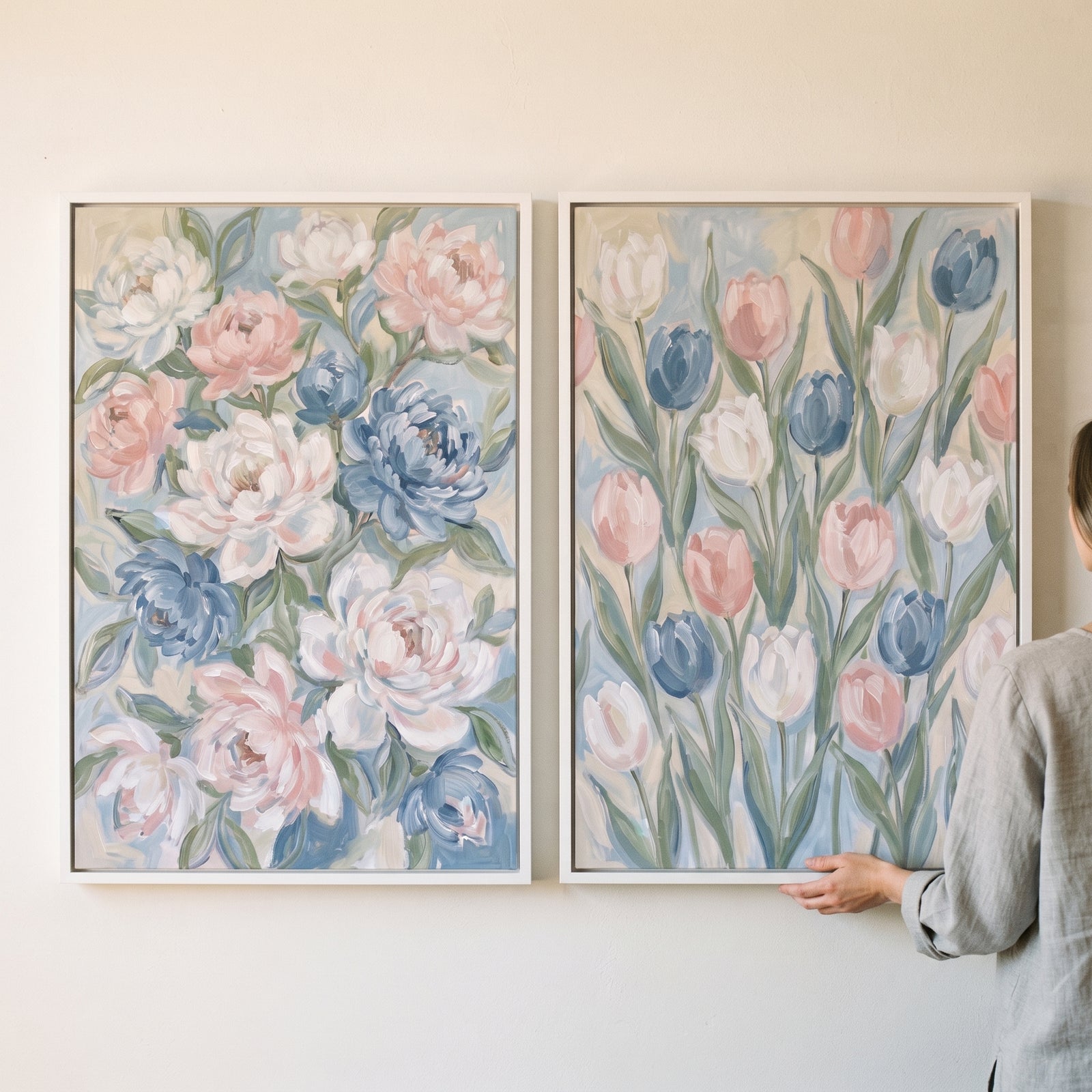 Blush blue spring floral wall art set of 2 with soft-focus peonies and tulips in white frames on a light wall.