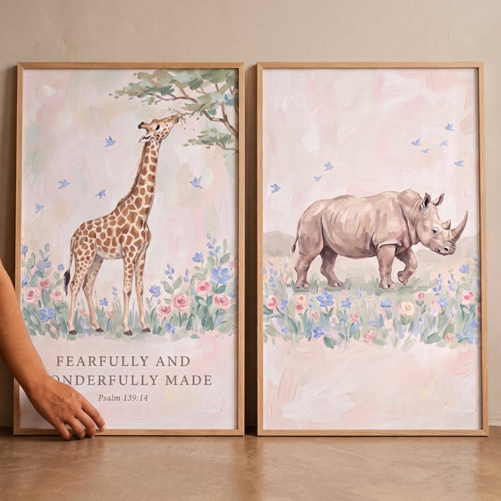 Blush floral savanna animals wall art set of 2 featuring a giraffe and rhino with soft flowers and a Bible verse.