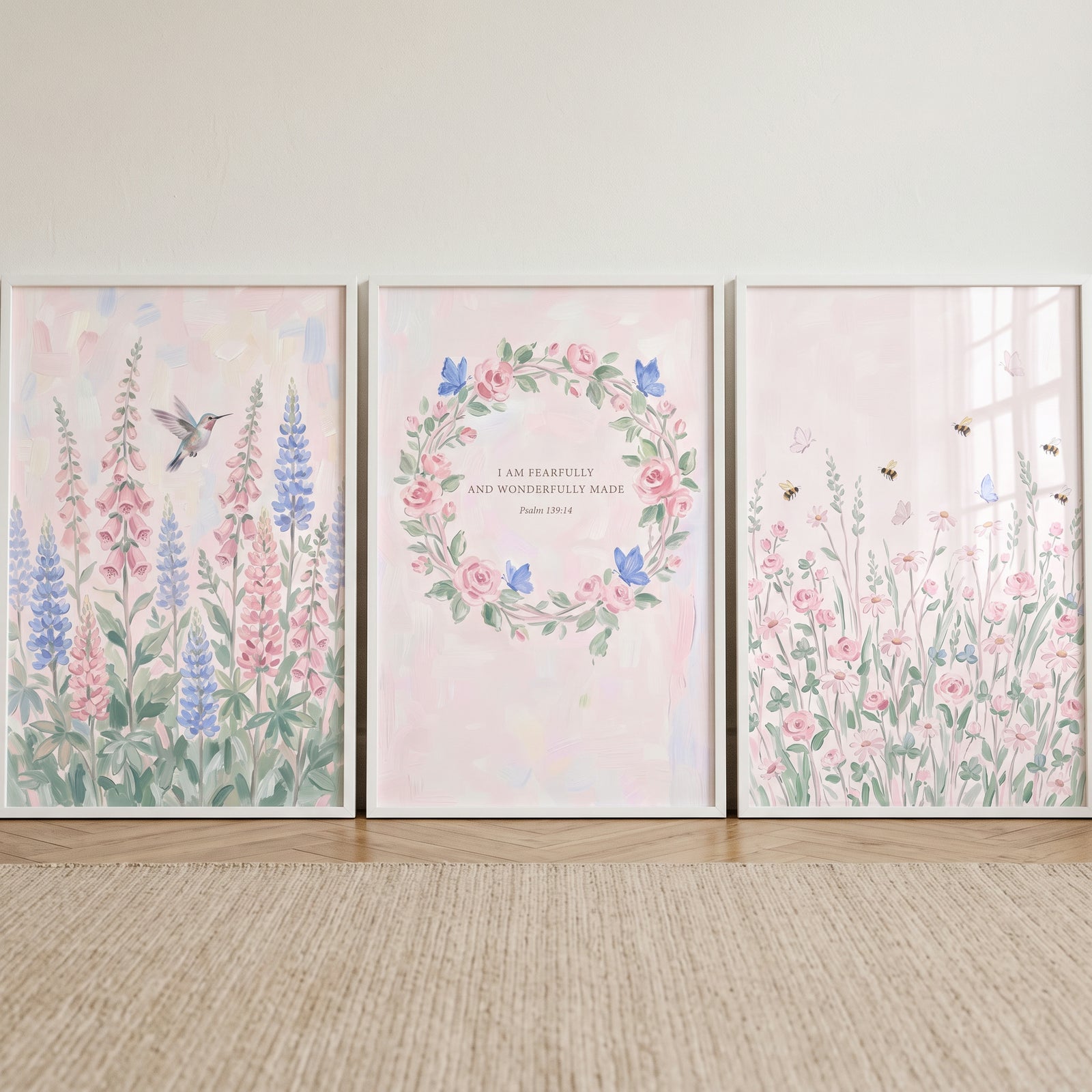 Blush pastel botanical garden wall art set of 3 with flowers, a hummingbird, insects, and a floral wreath with scripture.