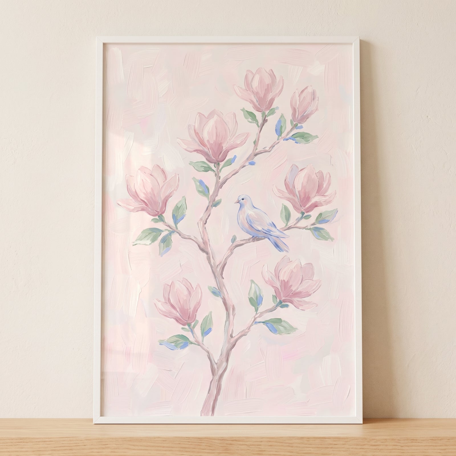 Blush pink magnolia floral wall art features a small blue bird perched on a branch with pink blossoms.