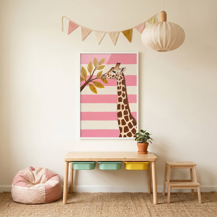 Blush pink striped giraffe wall art above a wooden table with bins in a playroom with a bean bag and paper lantern.