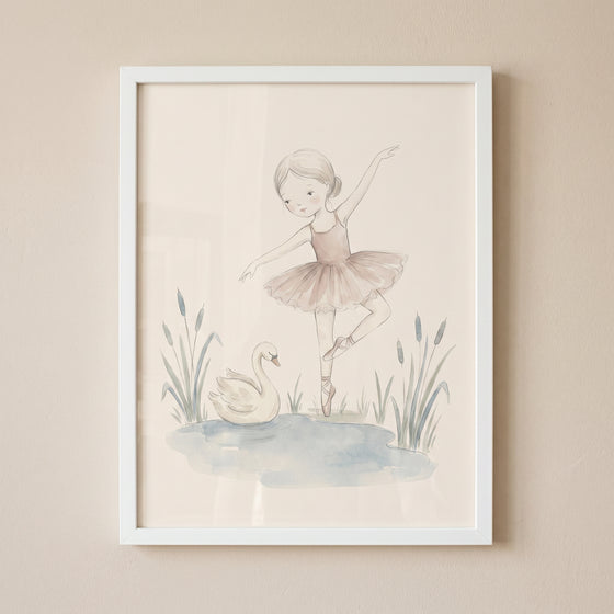 Framed blush tutu ballerina wall art of a girl dancing on one toe near a swan and pond with reeds.