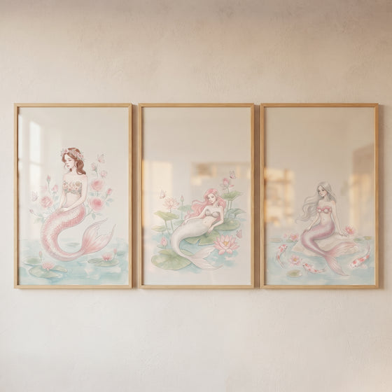 Blush watercolor ethereal mermaid wall art set of 3 shows three framed mermaid illustrations in soft pastel colors.