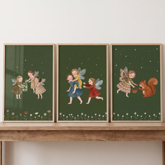 Boho green forest fairies wall art set of 3 with whimsical winged girls playing and a squirrel on starry green backgrounds.