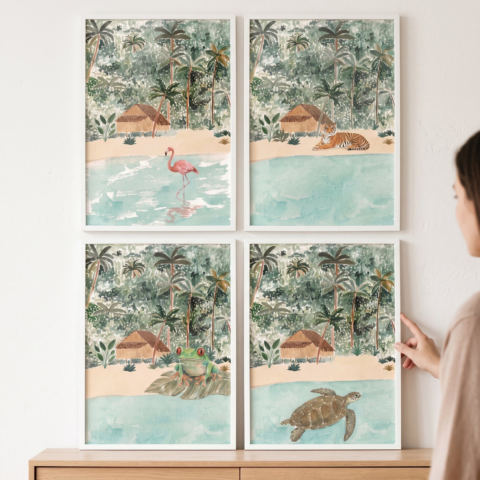 Boho watercolor tropical animals wall art set of 4 featuring a flamingo, tiger, frog, and sea turtle in white frames.