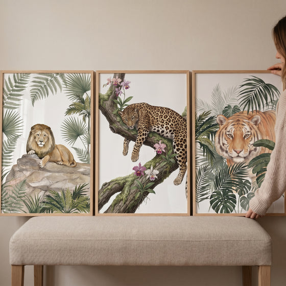 Botanical wild big cat wall art set of 3 featuring a lion, leopard, and tiger in lush jungle foliage.