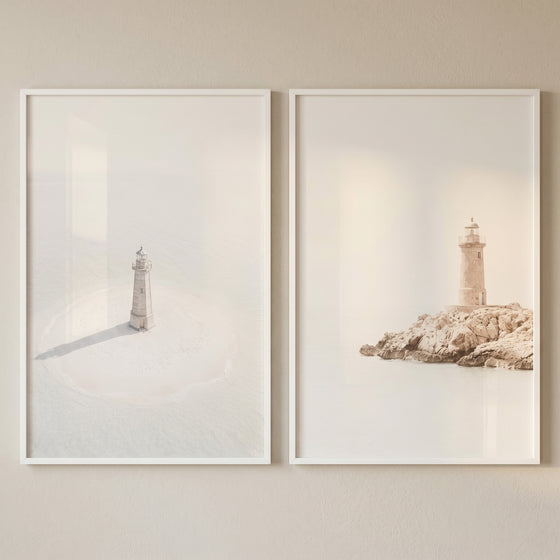 Bright minimalist coastal lighthouse wall art set of 2 with soft views of a rocky shore and a misty sandy islet.