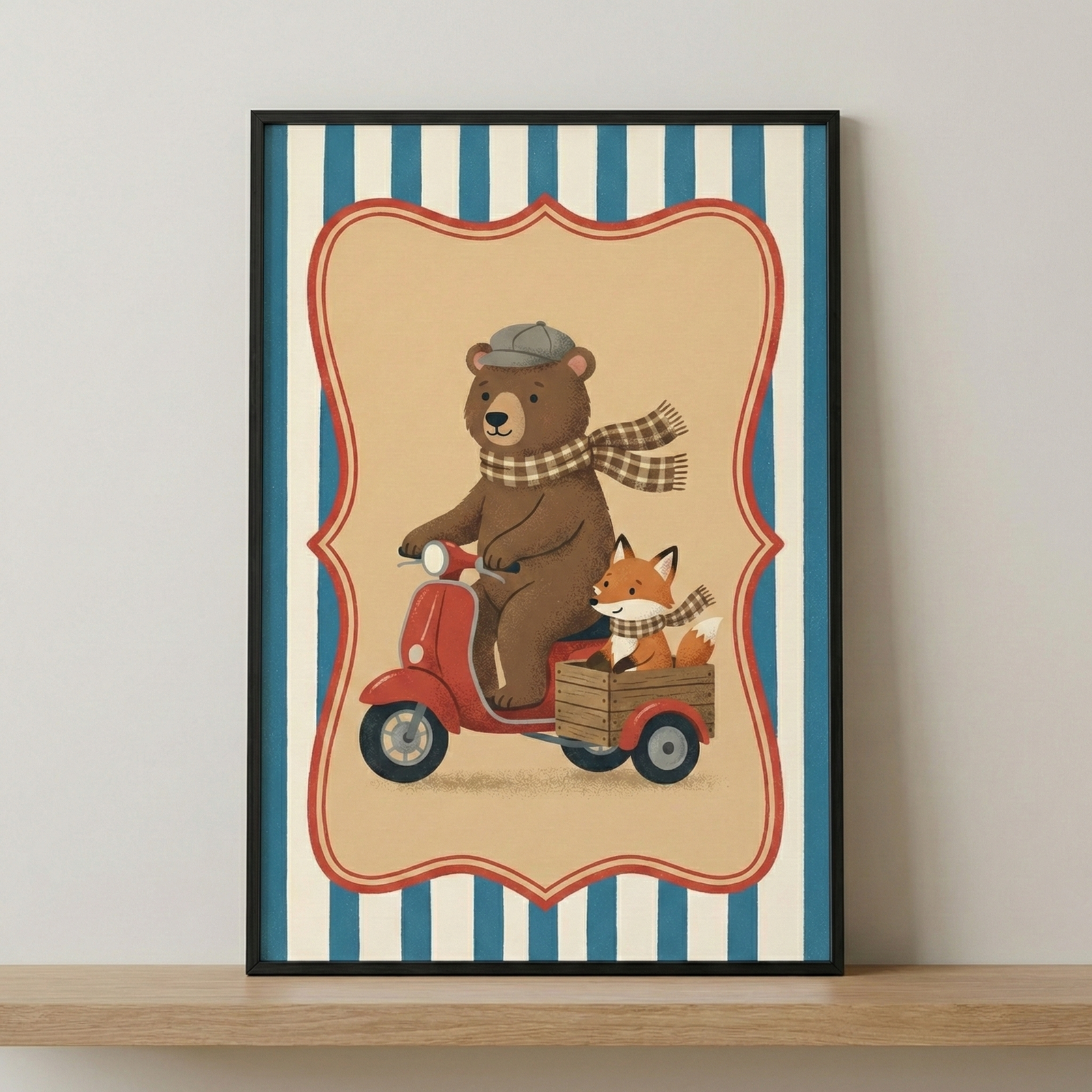 An illustration in a black frame shows a brown bear wearing a grey flat cap and a brown checkered scarf, riding a red three-wheeled scooter. A small orange fox wearing a matching checkered scarf sits in a wooden crate attached to the back of the scooter. The characters are centered within a decorative, wavy-edged red frame against a light beige background. The overall background consists of vertical blue and white stripes. The framed artwork is displayed on a light wooden shelf against a neutral wall.