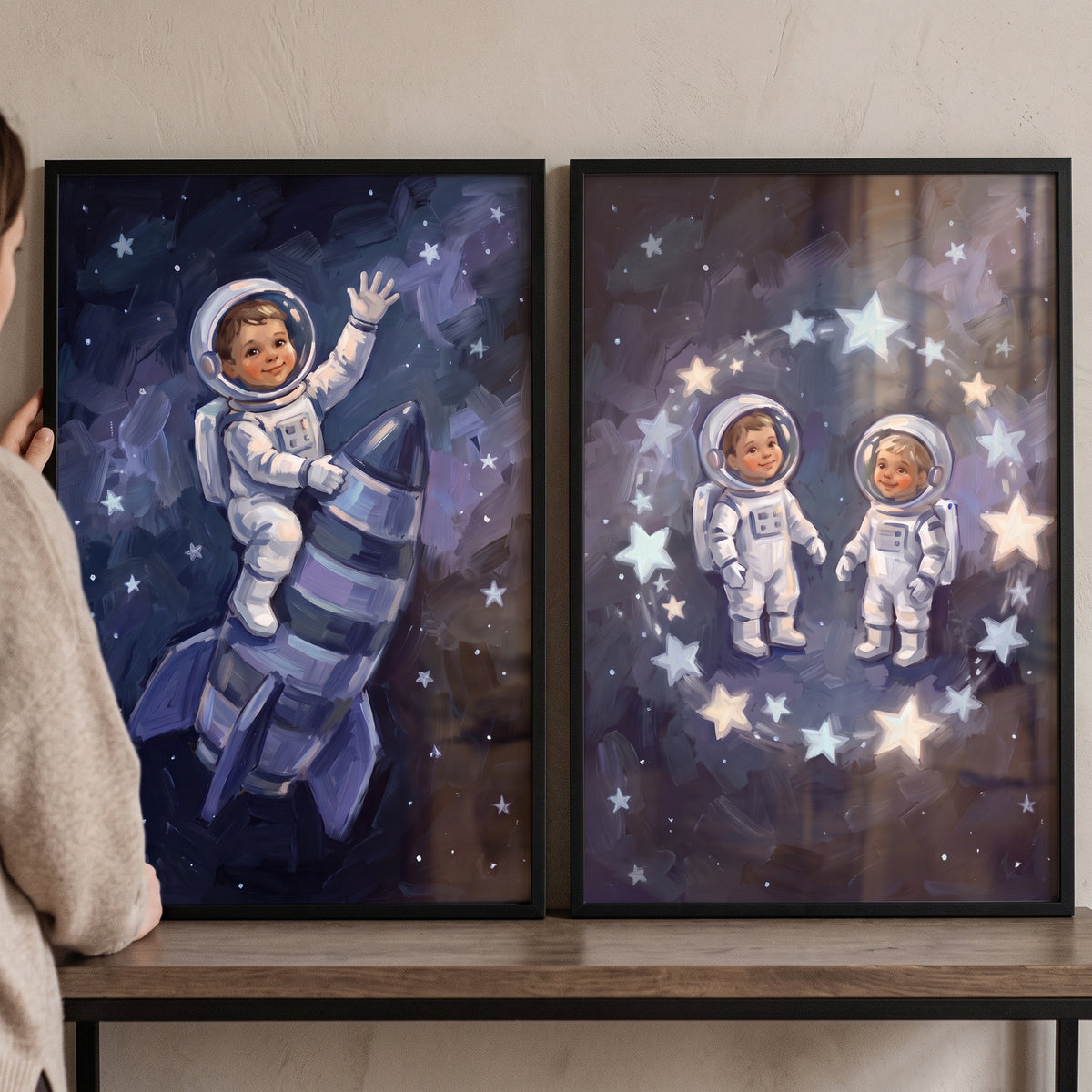 Brushstroke starry baby astronaut artwork set of 2 with babies on a rocket and inside a ring of stars in space.