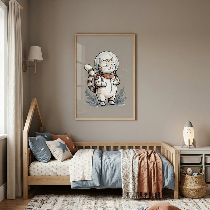 Bubble helmet astronaut cat wall art hangs over a wooden bed in a neutral child's room with a rocket-shaped lamp.