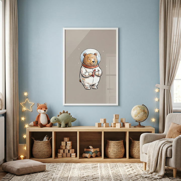 Bubble helmet space bear wall art hangs on a blue nursery wall over a shelf with toys, a globe, and star lights.