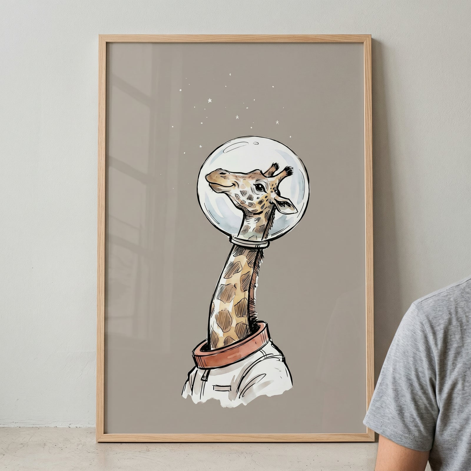 Framed bubble helmet space giraffe wall art shows a giraffe in a spacesuit under a cluster of tiny stars.