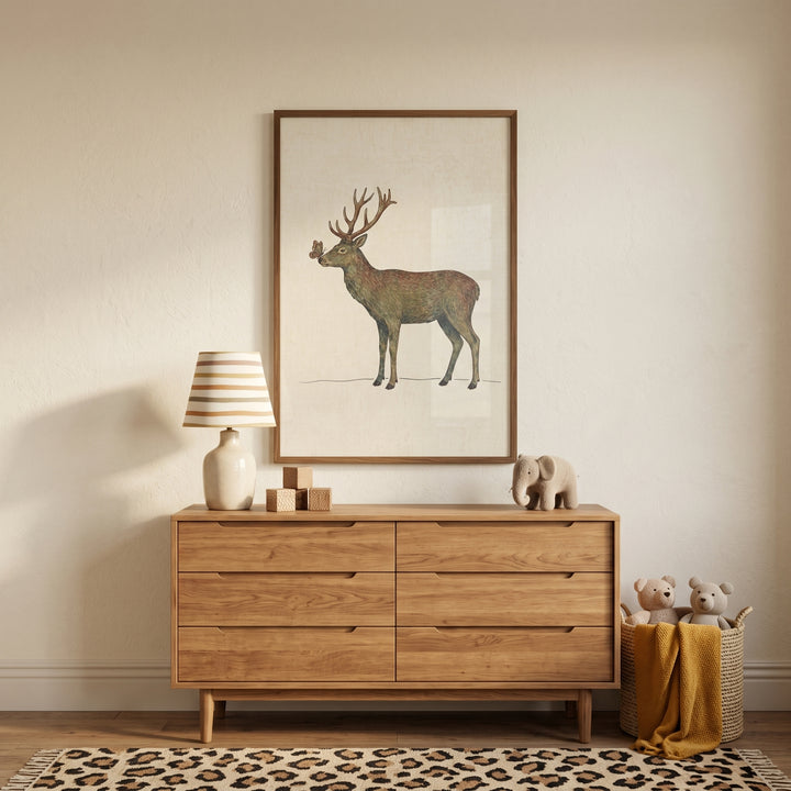 Butterfly nose woodland buck wall art hangs over a wooden dresser with a striped lamp, toys, and a leopard print rug.