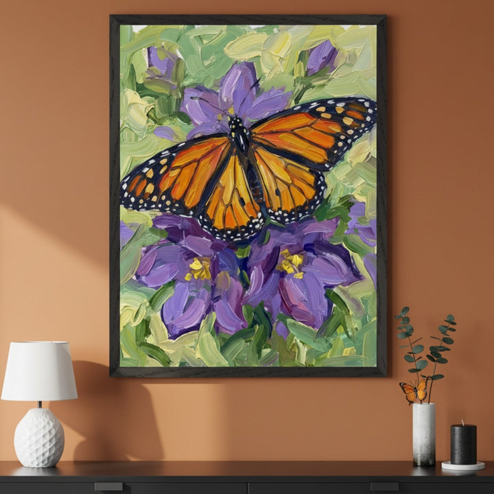 Modern living room with a dark dresser. A large framed oil painting of a monarch butterfly on purple flowers with green leaves, in an impasto style, hangs above the dresser. A white lamp and a vase with eucalyptus are on the dresser.