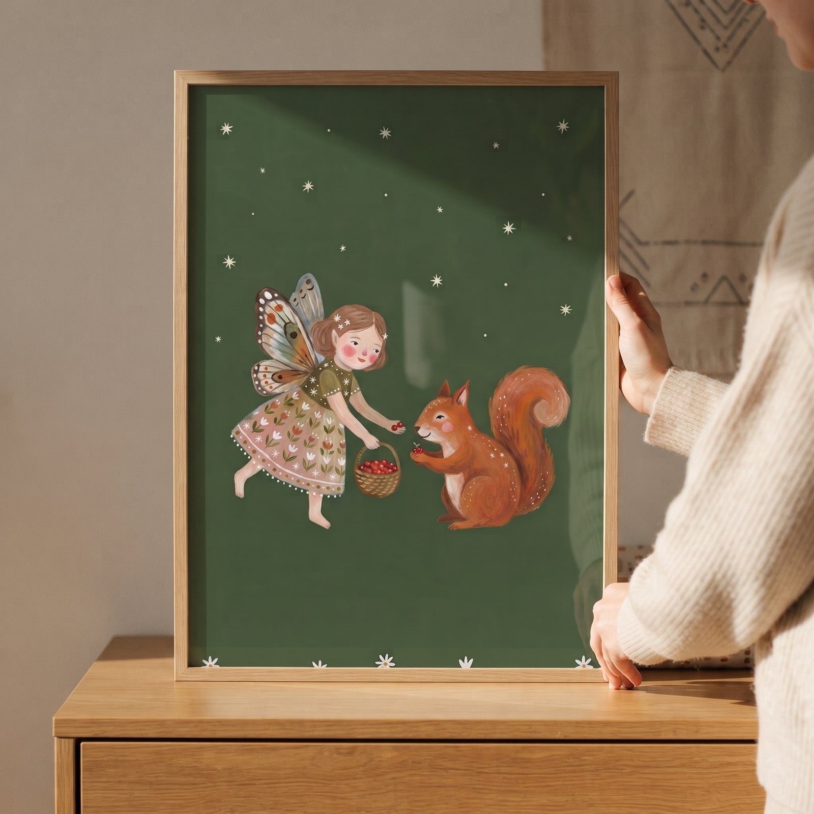 Butterfly wing squirrel fairies wall art features a fairy offering red berries to a squirrel on a starry green background.