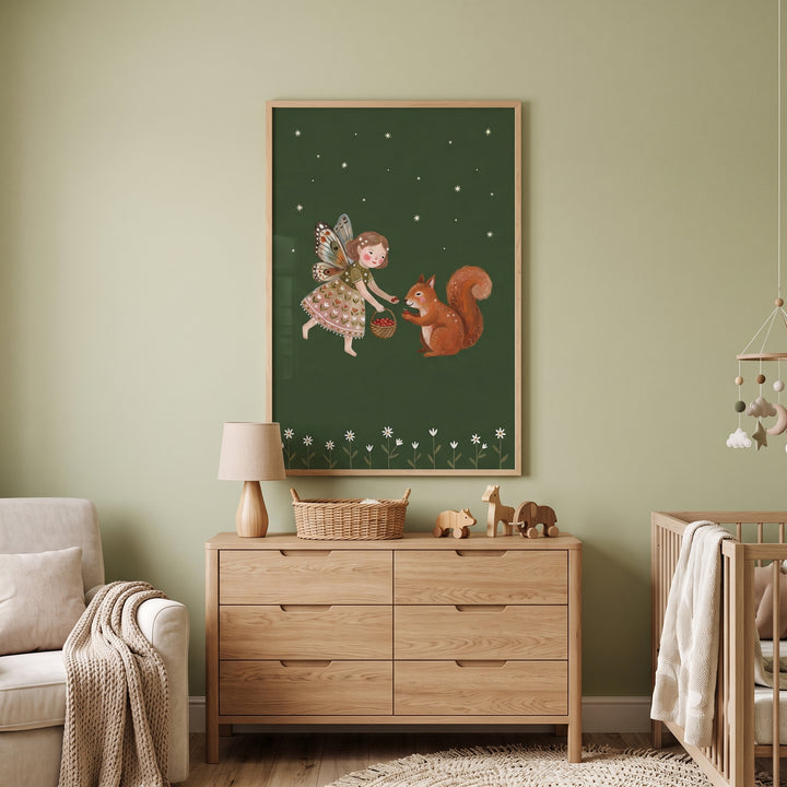 Butterfly wing squirrel fairies wall art hangs on a sage green nursery wall above a wooden dresser and near a baby crib.